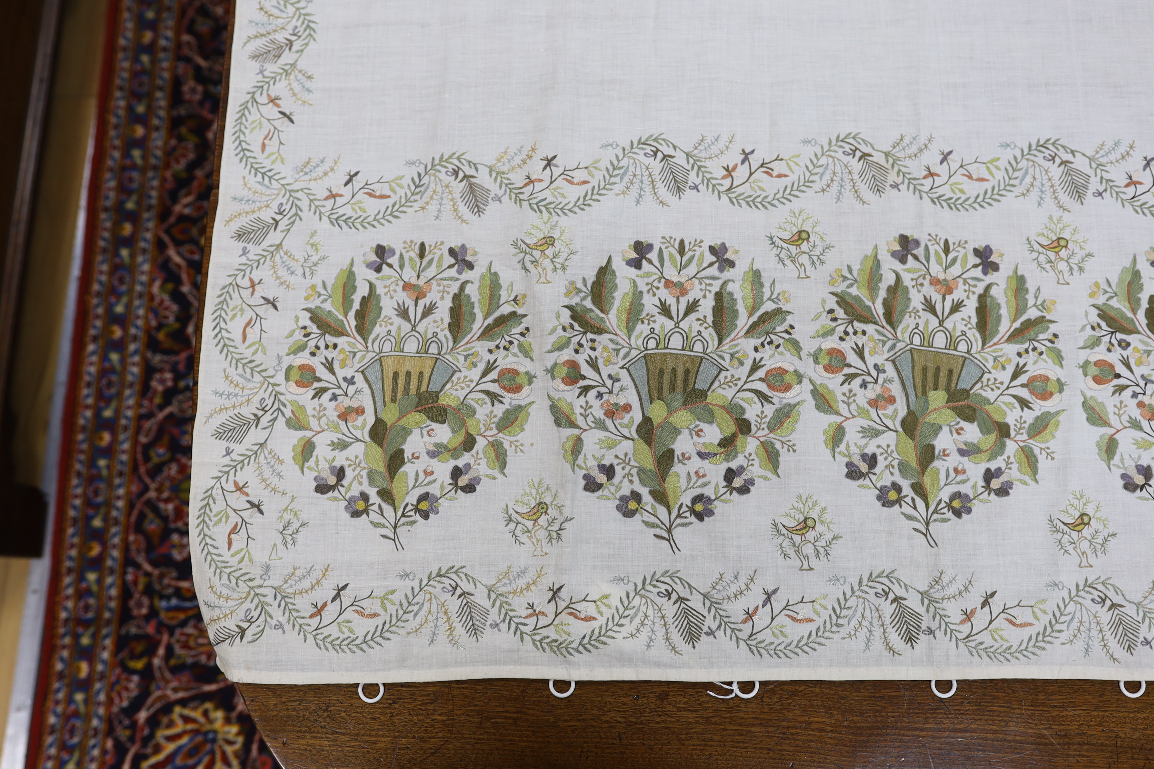 A late 18th-19th century fine linen chain stitched floral embroidered panel, possibly Kashmiri, using traditional design elements and embroidery similar from earlier embroideries of this kind worked on narrower looms, 22